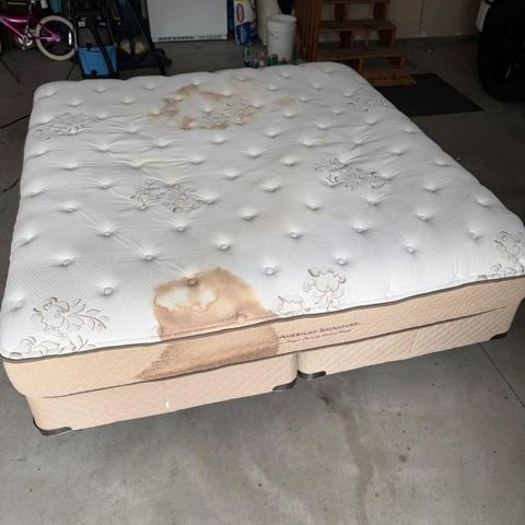 King mattress with large stains before cleaning